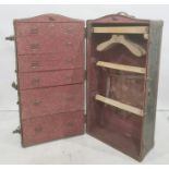 Vintage travelling trunk opening to reveal hanging space and drawers