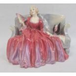 Early Royal Doulton china figure of a girl on a settee 'Sweet and Twenty' HN1298, 15cm high