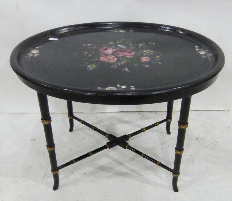 Papier mache tray-topped table with floral design, on bamboo-style ebonised base