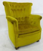 Early 20th century armchair with buttonback, upholstered in green velvet, on bun feet