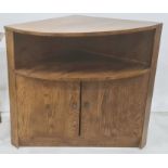 20th century oak corner cupboard, the bow front with under shelf, above two cupboard doors, plinth