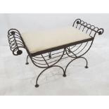 Modern wrought iron stool of scrolling design, with upholstered seat, 104cm wide