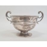 An early 20th century silver two-handled circular trophy cup, on circular base, Birmingam 1918,