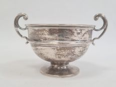 An early 20th century silver two-handled circular trophy cup, on circular base, Birmingam 1918,