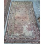 Eastern rug with diamond pattern to the central field, stepped border, 310 x 191cm