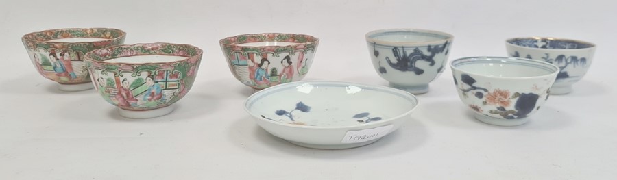 Three Chinese porcelain tea bowls with blue landscape and plant decoration, similar saucer and a set