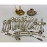 A quantity of silver plated flatware, teaspoons, a silver plated chamberstick and another gilt