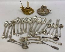 A quantity of silver plated flatware, teaspoons, a silver plated chamberstick and another gilt