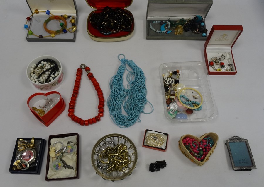 Wooden suitcase and contents of costume jewellery including a glass bead necklace, crystal pendants,