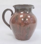 Studio pottery vase, ovoid with treacle brown glaze and line decoration of stylised plants, 26.5cm