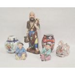 Japanese Imari porcelain barrel-shaped vase, 13cm high, tinted bisque and glazed figure of a