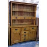 Modern pine dresser, the plate rack fitted with three open shelves and three short drawers, the base