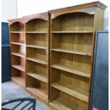 Set of three tall pine open bookcases each with stepped cornice over five open shelves, 92cm wide