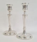 A pair of 1980s silver-filled candlesticks, tapering on circular bases, Birmingham 1987, maker W I
