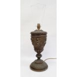 Table lamp with 19th century oil lamp body, embossed cherub decoration, 35cm high