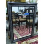 Modern black painted wall mirror of rectangular form with bevel mirror plate, 110cm x 80cm