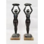 Pair of Limousin bronze Art Nouveau figures of ladies holding aloft baskets of flowers