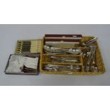Wicker tray containing assorted plated flatware, mainly Elkington plate