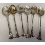 A set of six Victorian silver teaspoons, scallop shaped with art nouveau handles, makers William