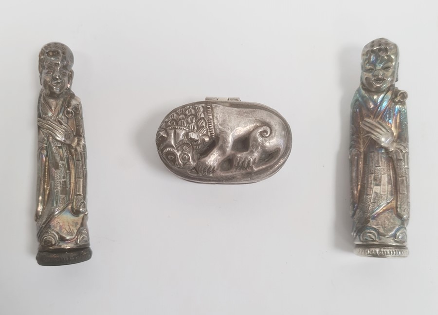 Two white metal figural sifters, modelled as robed Chinese figures, their foreheads pierced, 8cm