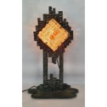 Iron and glass lamp of brutalist form Condition ReportThe height is 67cm approx. There is a crack to