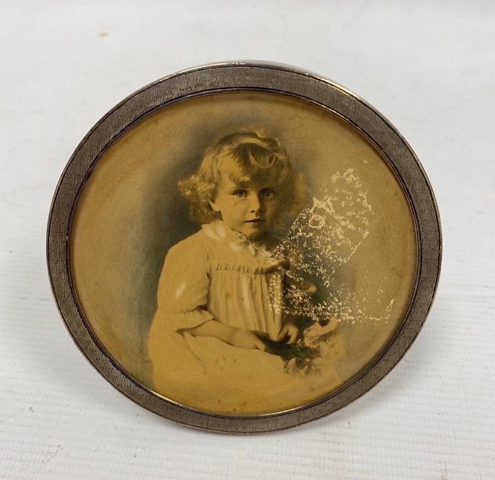 An early 20th century circular silver mounted picture frame, London 1903, maker John Collard