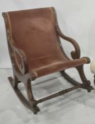 19th century mahogany framed open arm rocking chair with scroll arms and turned stretcher