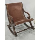 19th century mahogany framed open arm rocking chair with scroll arms and turned stretcher