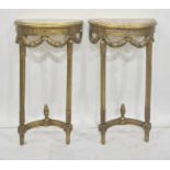 Pair of reproduction gilt wood and marble console tables, each of demi-lune design, decorated with