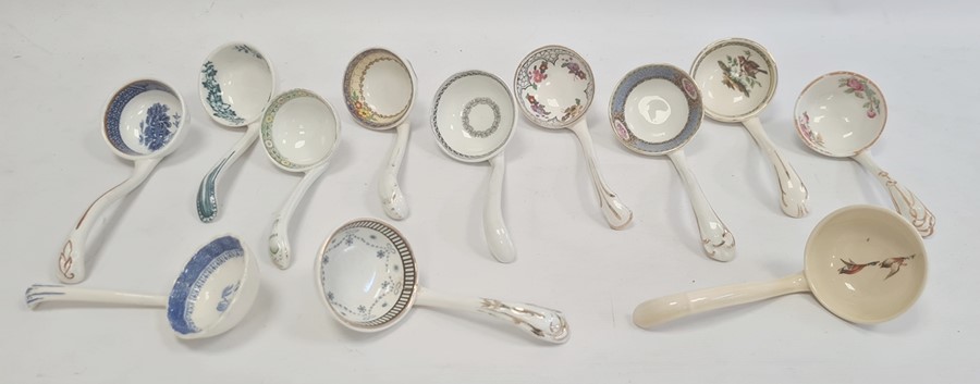 Large quantity of Victorian and later pottery sauce ladles, variously floral, geometric and