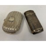 A silver coloured snuff box, marks worn and a silver vesta, marked LV, 2toz approx. in total (2)