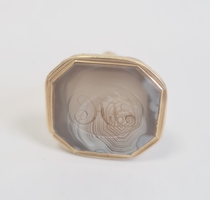 Late Georgian carved banded agate seal with foliate embossed gold-coloured mount, 3.5cm high