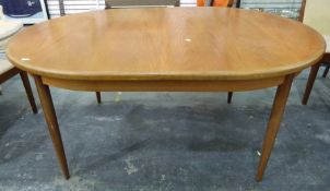 1970's G-Plan style teak extending dining table of oval form on tapering circular supports, 112 x