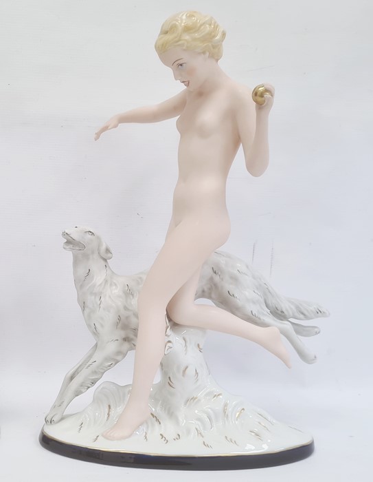 Large Royal Dux Art Deco-style tinted bisque and glazed figure of female nude throwing a ball for