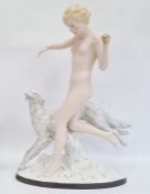Large Royal Dux Art Deco-style tinted bisque and glazed figure of female nude throwing a ball for
