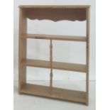 Pine three-height shelf with turned central spindles, 66cm wide
