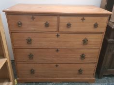 Early 20th century pine chest of two short and three long drawers, on plinth base and with Gothic