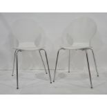 Set of eight modern white and chrome based stackable dining chairs (8)