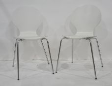 Set of eight modern white and chrome based stackable dining chairs (8)