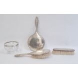 Silver three-piece dressing table set, Birmingham 1916, comprising hand mirror and two brushes,