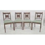 Four Edwardian oak dining chairs, the bar backs and central panel decorated with circular and reeded