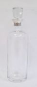 Baccarat glass decanter with silver mounts by Theo Fennell, London 1989, of bottle form with