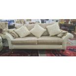 Lee Longlands three-seater sofa and matching chair in diamond-patterned upholstery, with brown