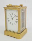 Brass carriage clock with Roman numerals to the dial