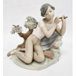 Lladro porcelain figure of boy with flute, 20cm high and another of girl seated with lamb (2)