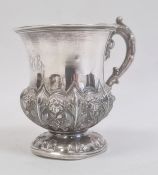A William IV silver christening mug, engraved 'RHB', floral repousse decoration, parcel gilt