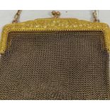 A 9ct gold chain purse, foliate decoration to clasp, 118g approx. Condition Reportsee image it is as