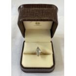 An 18ct white gold solitaire diamond ring, marquise cut, 12.5mm x 6.78mm x 4mm, total weight 2.05ct,
