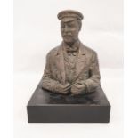 20th century resin bust of gentleman in cap holding binoculars, 27cm high