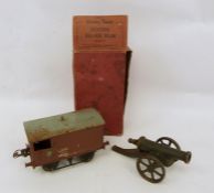 Hornby carriage in box and a model cannon (2)